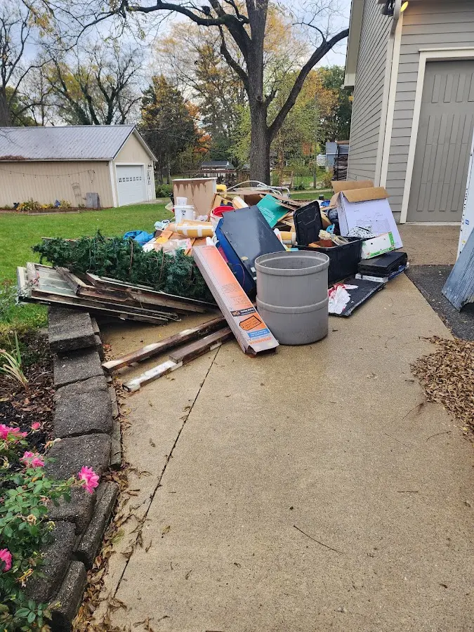 Dumpster being loaded with debris for Estate Cleanout Dumpster Rental in South Kensington